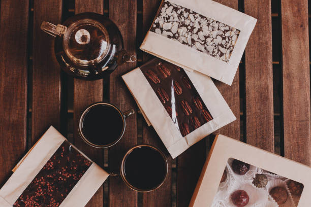 istock Handmade chocolates and tea on a cozy wooden background. 1173674963