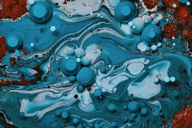 istock mixing blue and orange colors paints 1173676910