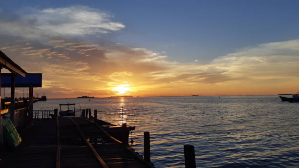 istock The sun sets on the horizon 1173684593