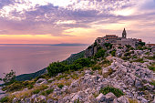 The famoud Lubenice village at sunset over the sea in Cres island Croatia