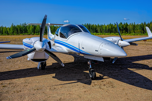 KOTKA, FINLAND - Aug 10, 2019: Four-seat light all-metal twin engine propeller-driven utility and trainer aircraft Diamond DA-42-VI Twin Star OH-DAB parked on Karhula aviation museum airshow.