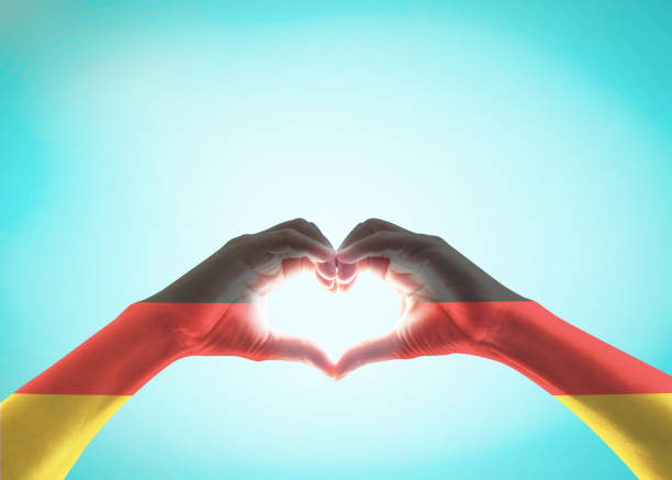 istock Germany national flag on people heart shape hands. 1173695758