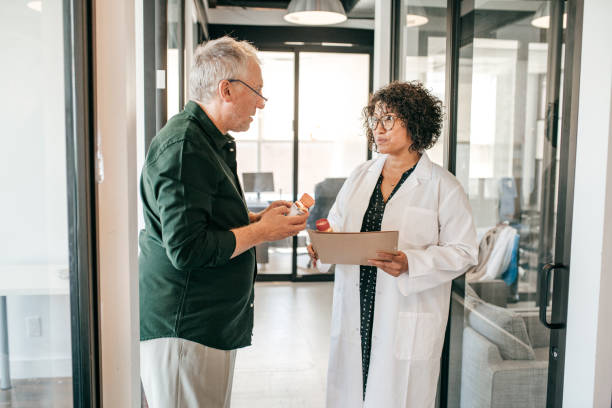 istock Senior men attended by a doctor 1173695774