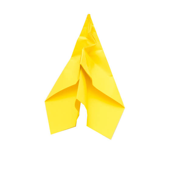 Inspiration and failure. Yellow wrinkled paper airplane isolated on white background. Copy space.