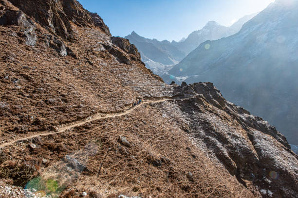 istock Hikers following a trail along the mountain side 1173697181