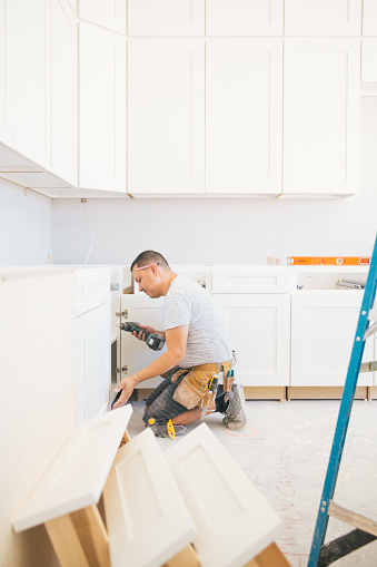 Installing a kitchen in a new house.