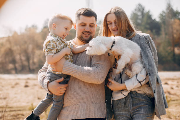 istock Cute family playing in a spring park 1173697829