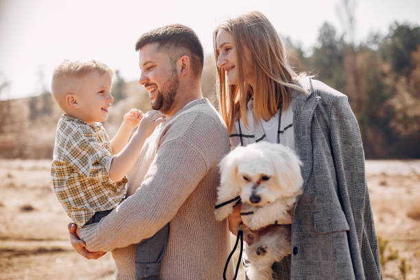 istock Cute family playing in a spring park 1173697836