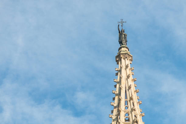 Statue of Saint Eulalia, patron saint of the city, on the spire of the Metropolitan Cathedral Basilica of Barcelona, located in the gothic quarter in Catalonia, Spain Statue of Saint Eulalia, patron saint of the city, on the spire of the Metropolitan Cathedral Basilica of Barcelona, located in the gothic quarter in Catalonia, Spain, Europe. santa eulalia stock pictures, royalty-free photos & images