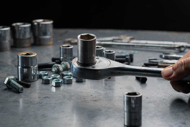 istock Close up automotive mechanic picking tools in garage 1173706113