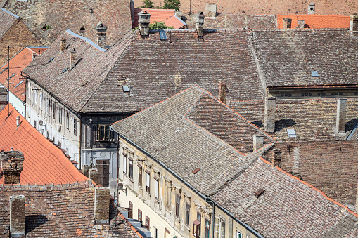 Picture of traditional roofs of buildings, used for residential purposes, typical from the central European architecture, taken in the district of Petrovaradin, in Novi Sad, Serbia