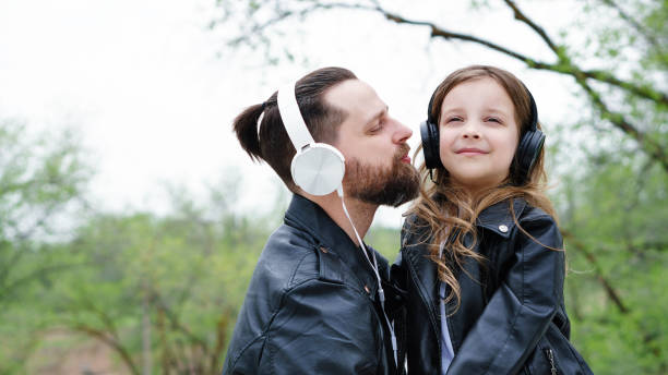 istock Dad and daughter walk around the city 1173711133