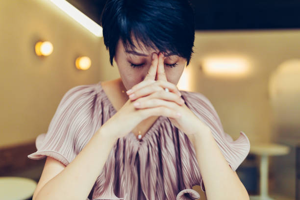 istock Stressed Asian woman at the cafe. 1173711896