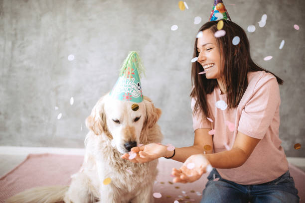 istock Joyful girl with falling confetti and her pet 1173713687