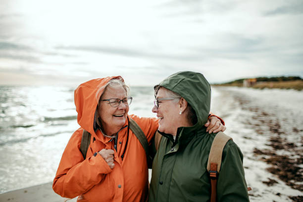 istock Seniors walking by the beach 1173713822