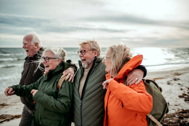 istock Seniors walking on the beach 1173713867