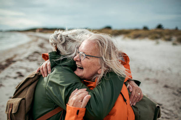 istock Seniors walking by the beach 1173715217