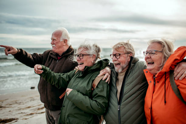 istock Seniors walking on the beach 1173715320