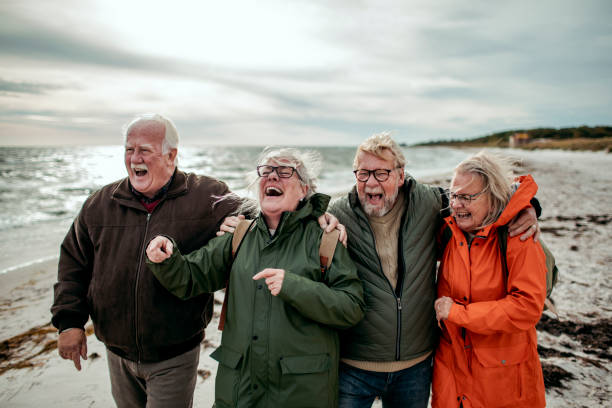 istock Seniors walking on the beach 1173716326
