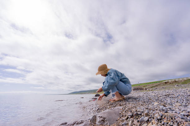 istock a teenager playing by the lake side 1173717260