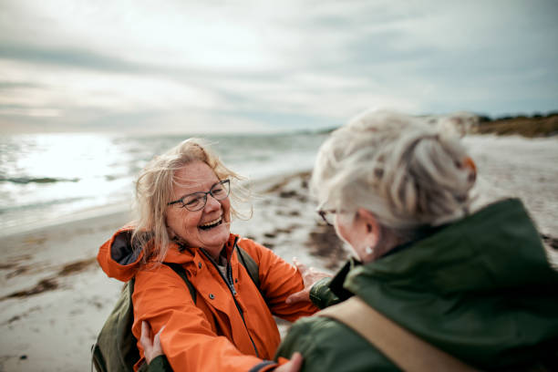 istock Seniors walking by the beach 1173717344