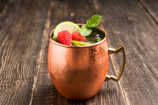 istock Raspberry and lime cocktail in copper mug (variation of Moscow mule) on the rustic background 1173717993