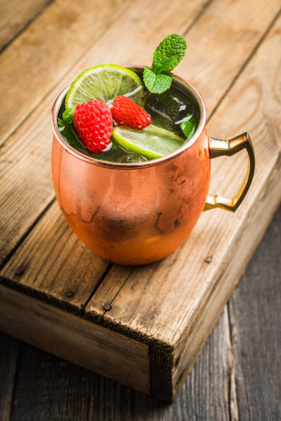 istock Raspberry and lime cocktail in copper mug (variation of Moscow mule) on the rustic background 1173717994