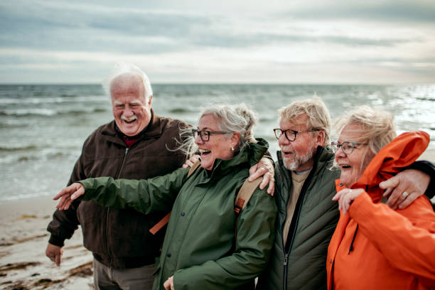 istock Seniors walking on the beach 1173717998