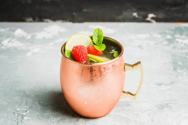 istock Raspberry and lime cocktail in copper mug (variation of Moscow mule) on the rustic background 1173718001