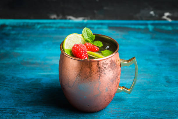 istock Raspberry and lime cocktail in copper mug (variation of Moscow mule) on the rustic background 1173718022