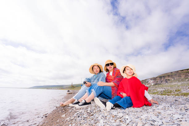 mother and two daughters by the lake side