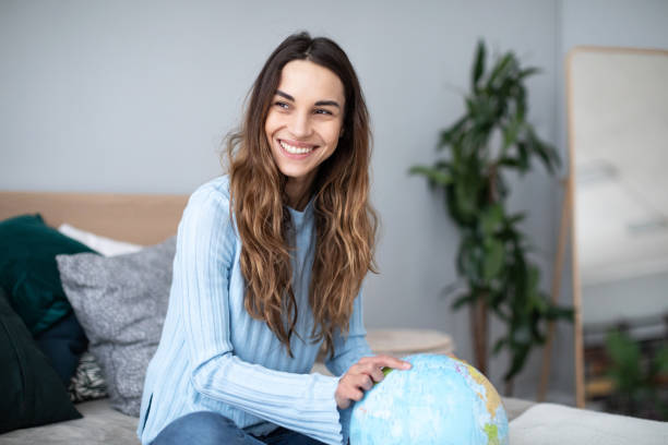 istock Happy woman planning a trip. 1173721132