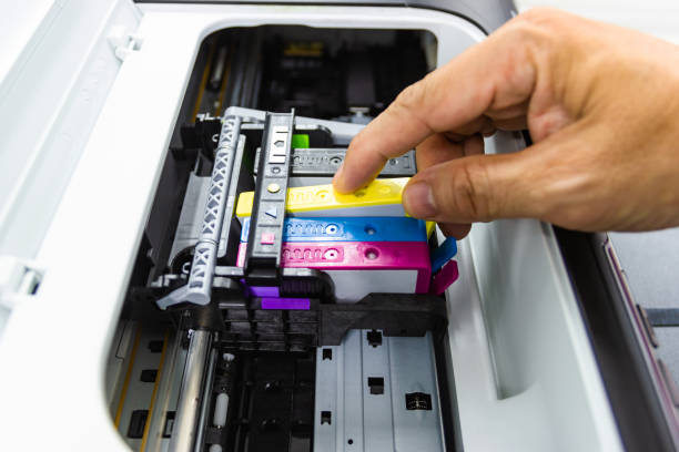 istock Technicians are install setup the ink cartridge or inkjet cartridge 1173721332