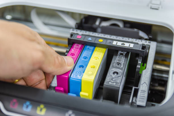 istock Technicians are install setup the ink cartridge or inkjet cartridge 1173721411