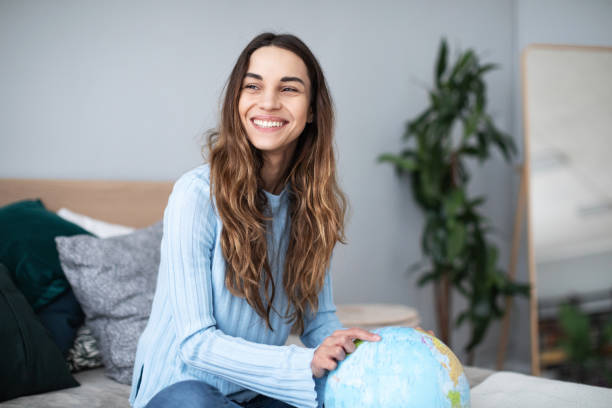 istock Happy woman planning a trip. 1173722160