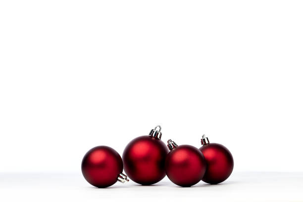 istock red christmas balls isolated on white background 1173723188