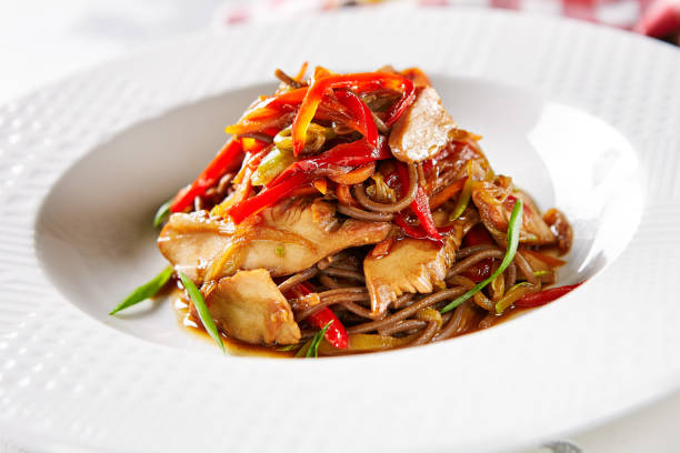 istock Asian Style Soba with Chicken and Vegetables on Elegant Restaurant White Plate Close Up. Traditional Japanese Buckwheat Noodles Zaru with Poultry Meat, Greens and Vegetables Top View 1173727845
