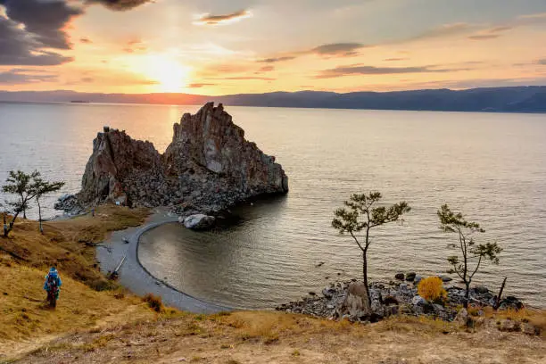 Shamanka Rock on Baikal lake near Khuzhir at Olkhon island in Siberia, Russia. Lake Baikal is the largest freshwater lake in the world.