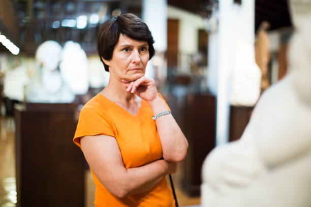 istock Female looking at museum exposition 1173731674