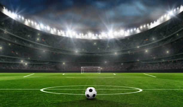 campo de fútbol por la noche con el gol de bal y fútbol - football fotografías e imágenes de stock