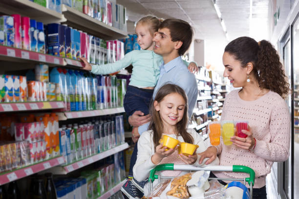 istock customers with children selecting sweet dairy products in hypermarket 1173735132