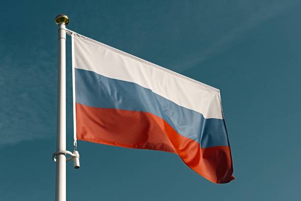 istock flag of Russia on blue sky 1173735226