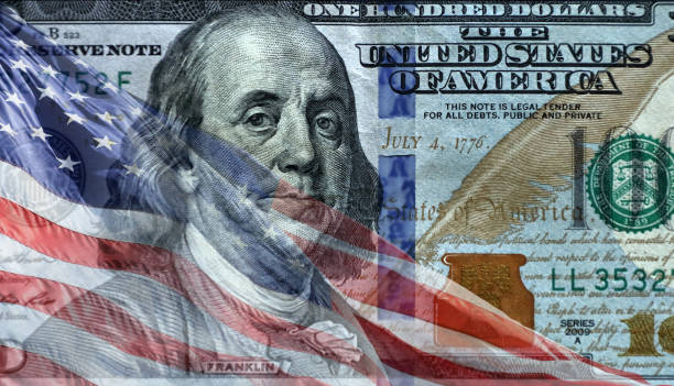 istock American flag over American dollar 1173735558