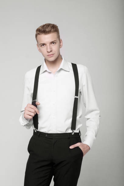 istock young serious man on gray background in classic style 1173736138