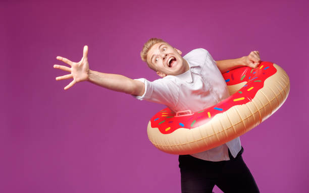 istock office worker with swimming circle  wants for holidays 1173736211
