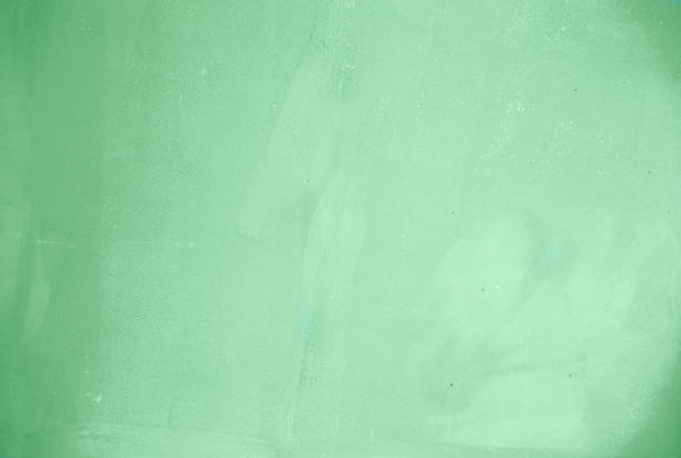 istock Trendy mint colored rough concrete textured background. 1173736401