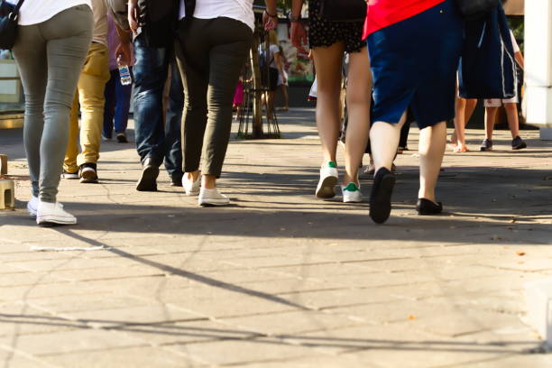 istock Low section of People Walking on Street 1173740634