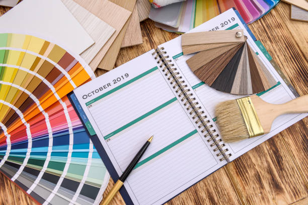 istock Notepad with painting tools and wooden sampler 1173742330