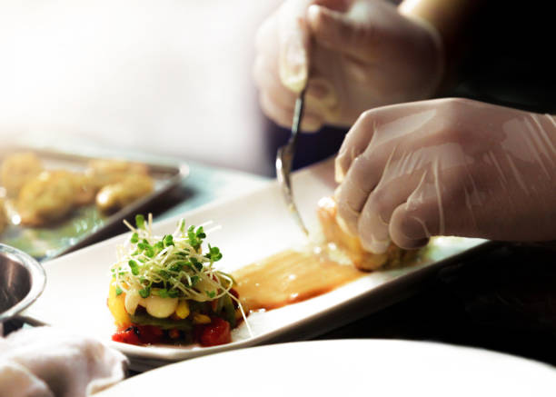 istock Chef preparing food in the kitchen, chef cooking, Chef decorating dish 1173747033