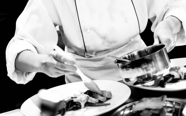 istock chef preparing food, chef cooking in a kitchen, chef at work, Black & White 1173747055